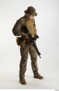 Casey Schneider in WDL Marpat Pose 5 loading gun standing…